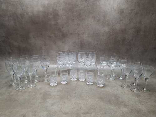 Assorted glassware including Luigi Bormioli stemmed wine glasses