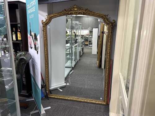 Ornate gilt framed wall mirror