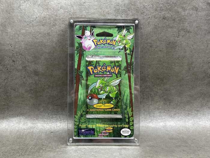 Pok&eacute;mon 1999 Jungle first edition booster pack with acrylic case