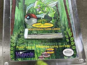 Pok&eacute;mon 1999 Jungle first edition booster pack with acrylic case - 3