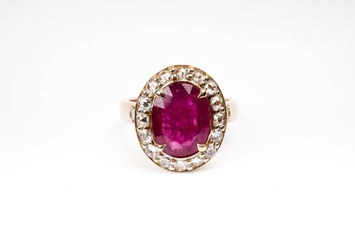 A ruby and diamond ring in 14 carat yellow gold