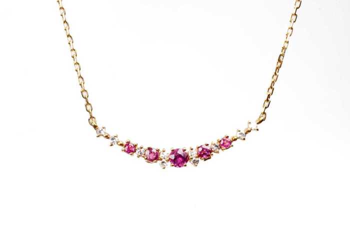 A ruby diamond necklace in 18 carat yellow gold