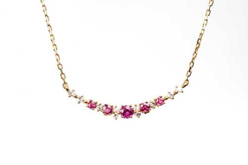 A ruby diamond necklace in 18 carat yellow gold