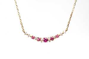 A ruby diamond necklace in 18 carat yellow gold