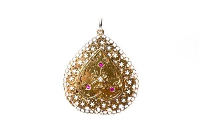 A ruby and white sapphire brooch/pendant in 22 carat yellow gold