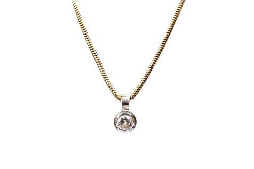 A diamond pendant and necklace in 18 carat yellow and white gold