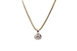 A diamond pendant and necklace in 18 carat yellow and white gold