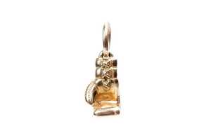 A solid boxing glove pendant in 9 carat yellow gold