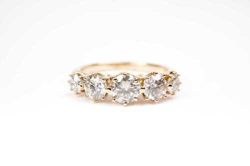 A diamond ring in 14 carat yellow gold