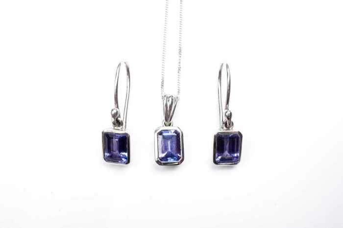 A tanzanite pendant and earring set in 18 carat white gold