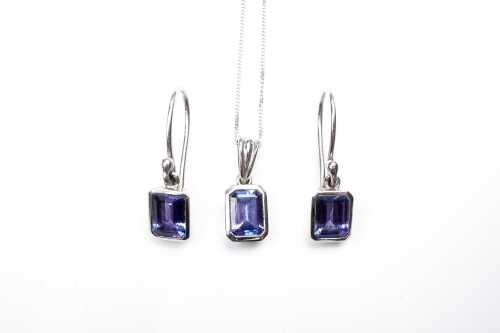 A tanzanite pendant and earring set in 18 carat white gold