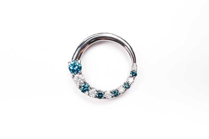 A white and treated blue diamond pendant in 14 carat white gold