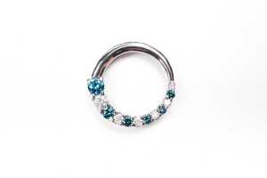 A white and treated blue diamond pendant in 14 carat white gold