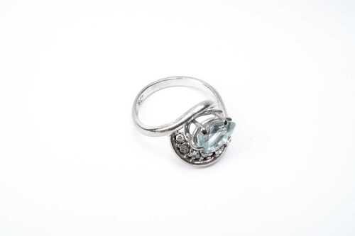 An aquamarine and diamond ring in 18 carat white gold