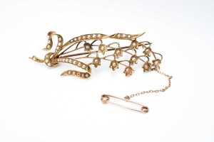 An antique seed pearl brooch in 15 carat yellow gold