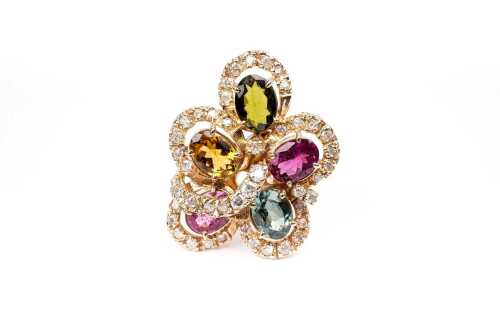 A diamond and multi gemstone ring in 14 carat yellow gold