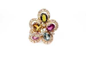 A diamond and multi gemstone ring in 14 carat yellow gold