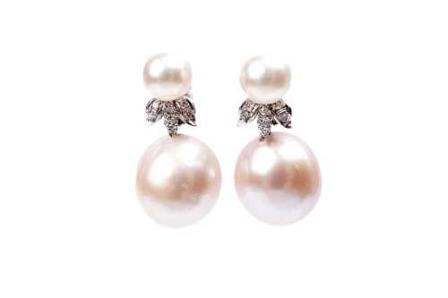 A pair of pearl and diamond earrings in 14 carat white gold
