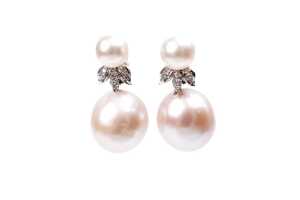 A pair of pearl and diamond earrings in 14 carat white gold