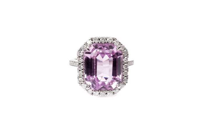 A kunzite and diamond ring in 14 carat white gold