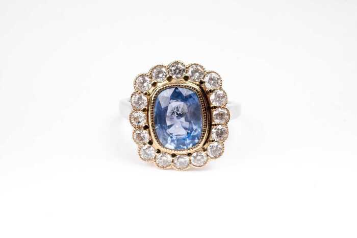A sapphire and diamond ring in 14 carat yellow and white gold