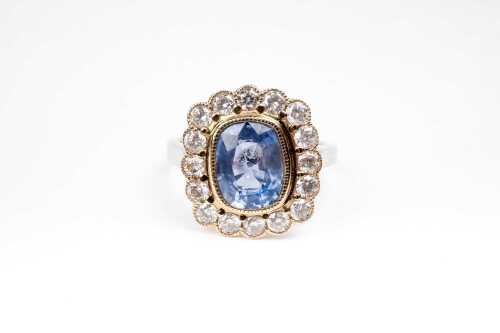 A sapphire and diamond ring in 14 carat yellow and white gold