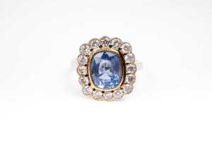 A sapphire and diamond ring in 14 carat yellow and white gold