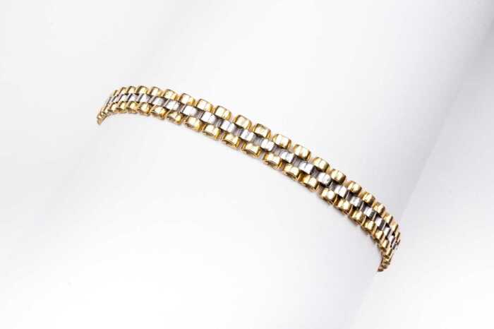 An Italian bracelet in 18 carat yellow and white gold