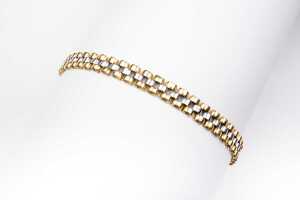 An Italian bracelet in 18 carat yellow and white gold