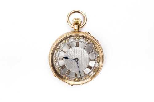 A Victorian open face pocket watch in 18 carat yellow gold