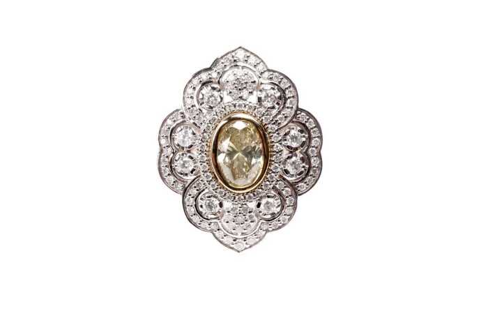 A diamond ring in 14 carat yellow and white gold