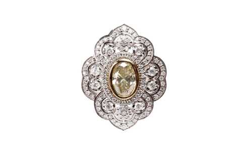 A diamond ring in 14 carat yellow and white gold