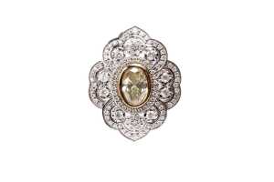 A diamond ring in 14 carat yellow and white gold