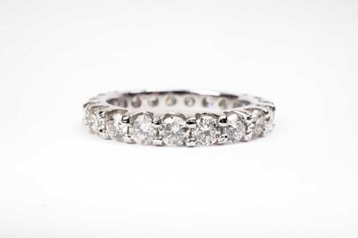A fully set diamond band in 14 carat white gold