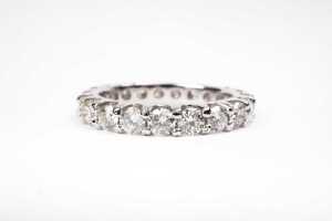 A fully set diamond band in 14 carat white gold