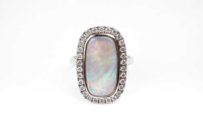 An Andamooka opal and diamond ring in 14 carat white gold