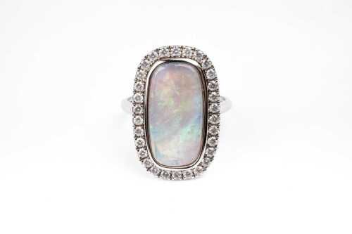 An Andamooka opal and diamond ring in 14 carat white gold