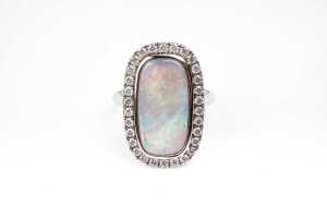 An Andamooka opal and diamond ring in 14 carat white gold