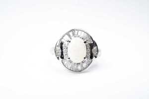 An opal and diamond ring in platinum