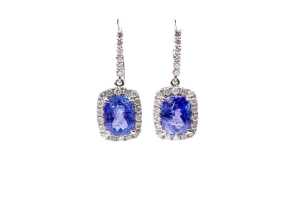A pair of tanzanite and diamond earrings in 14 carat white gold