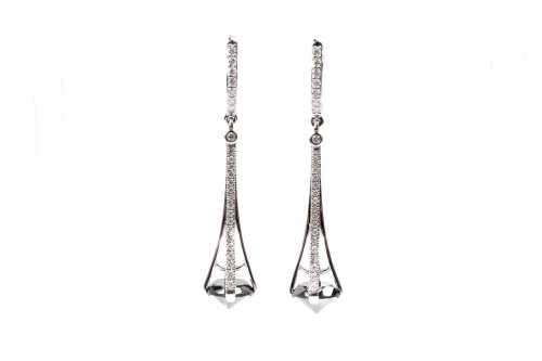 A pair of black and white diamond earrings
