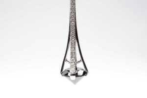 A pair of black and white diamond earrings - 2