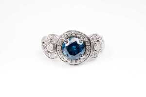 A treated blue and white diamond ring in 14 carat white gold