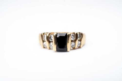 A sapphire and diamond ring in 18 carat yellow gold