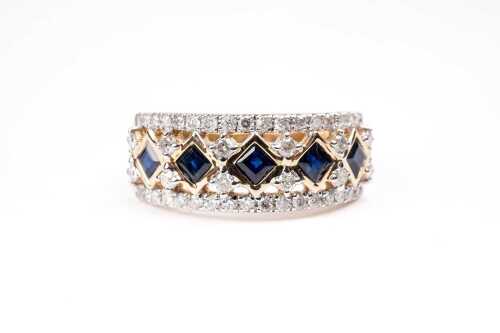 A sapphire and diamond ring in 14 carat yellow gold