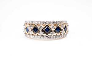 A sapphire and diamond ring in 14 carat yellow gold