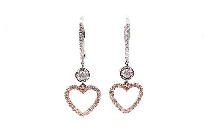 A pair of pink and white diamond earrings in 14 carat white and rose gold
