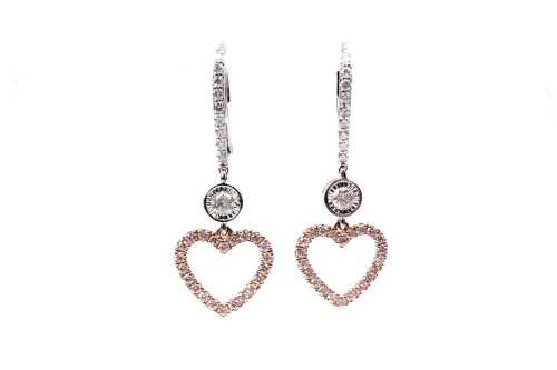 A pair of pink and white diamond earrings in 14 carat white and rose gold