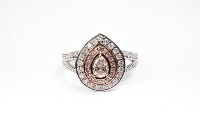 A pink and white diamond ring in 14 carat white and rose gold