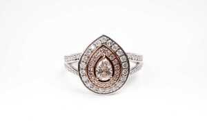 A pink and white diamond ring in 14 carat white and rose gold